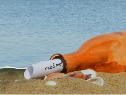 Picture: Bottle washed up on a beach with a note sticking out that says, 