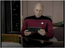 Picture: Capt. Picard reads from an tablet. catmichaelswriter.com
