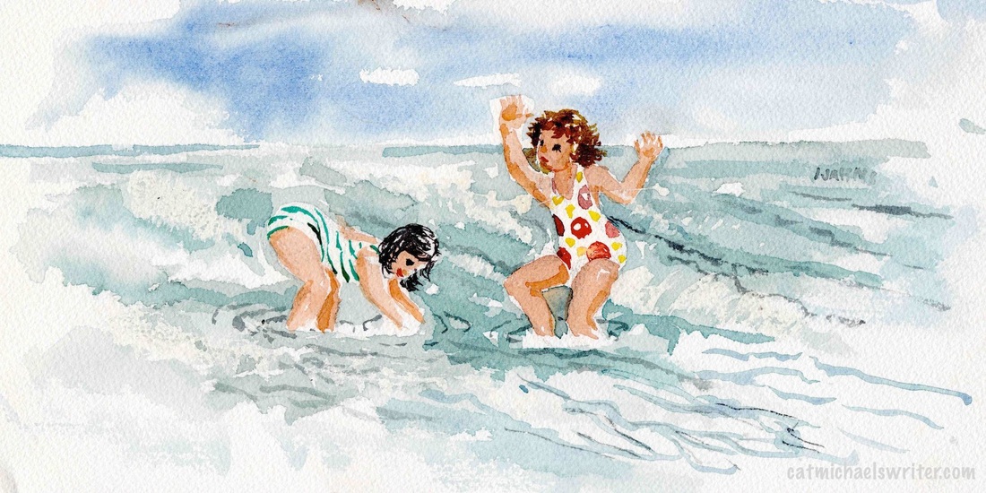 2 young girls in swim suites splash in ocean waves
