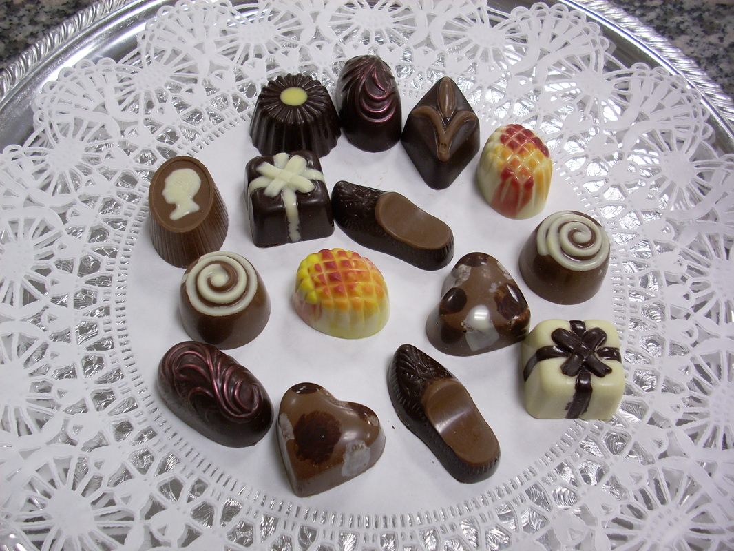 Picture: White doiley on a plate with about a dozen different pieces of yummy-looking chocolate