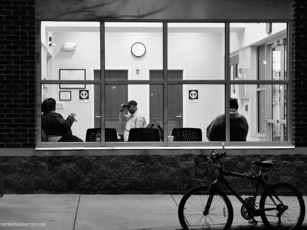 Picture: B&W photo of people waiting at a train station on a cold winter night www.catmichaelswriter.com